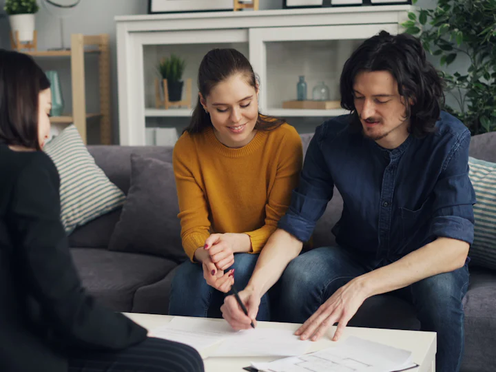 Solar advisor going over a financing plan with homeowners